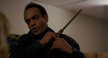 Movie still from “Dawn of the Dead” (1978), directed by George A. Romero – A man holding a pair of scissors in his hand; Close Up shot, Low angle