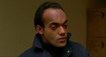 Movie still from “Dawn of the Dead” (1978), directed by George A. Romero – A person wearing a jacket; Close Up shot, High angle