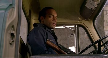 Movie still from “Dawn of the Dead” (1978), directed by George A. Romero – A man sitting in the driver's seat of a bus; Close Up shot, Low angle
