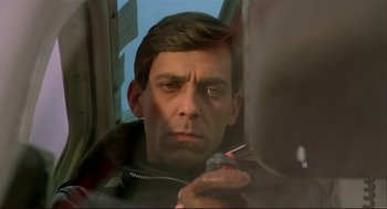 Movie still from “Dawn of the Dead” (1978), directed by George A. Romero – A person holding a screwdriver; Close Up shot, Low angle