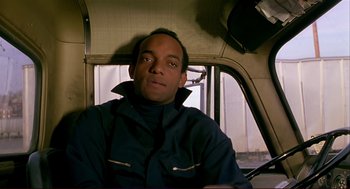 Movie still from “Dawn of the Dead” (1978), directed by George A. Romero – A man sitting in the driver's seat of a truck; Close Up shot, Low angle