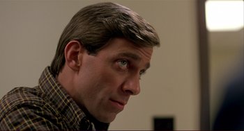 Movie still from “Dawn of the Dead” (1978), directed by George A. Romero – A person looking at the camera; Close Up shot, Over the shoulder angle