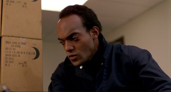 Movie still from “Dawn of the Dead” (1978), directed by George A. Romero – A person wearing a black jacket; Close Up shot, Low angle