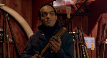 Movie still from “Dawn of the Dead” (1978), directed by George A. Romero – A man holding a fishing rod in his hands; Close Up shot, Low angle