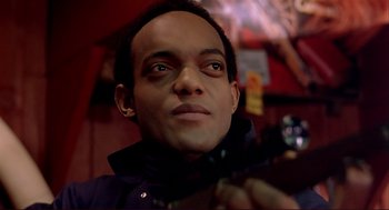 Movie still from “Dawn of the Dead” (1978), directed by George A. Romero – A man's face in front of a mirror; Close Up shot, Low angle