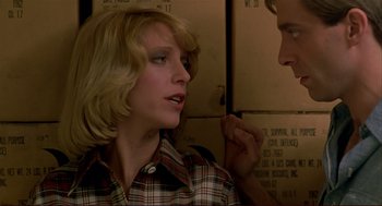 Movie still from “Dawn of the Dead” (1978), directed by George A. Romero – A man and a woman talking to each other; Close Up shot, Over the shoulder angle