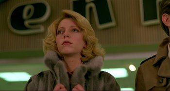 Movie still from “Dawn of the Dead” (1978), directed by George A. Romero – A woman with blonde hair wearing a fur coat; Close Up shot, Low angle