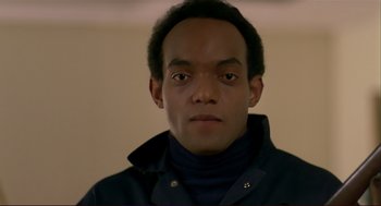 Movie still from “Dawn of the Dead” (1978), directed by George A. Romero – A young man wearing a black jacket and a black shirt; Close Up shot, Low angle
