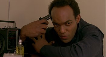 Movie still from “Dawn of the Dead” (1978), directed by George A. Romero – A man holding a gun up to his head; Close Up shot, Low angle