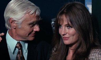 Movie still from “Day for Night” (1973), directed by François Truffaut – A man and a woman standing next to each other; Close Up shot, Over the shoulder angle