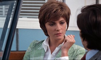 Movie still from “Day for Night” (1973), directed by François Truffaut – A woman sitting in front of a window with her hand under her chin; Close Up shot, Over the shoulder angle