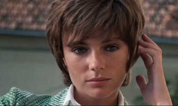 Movie still from “Day for Night” (1973), directed by François Truffaut – A person with short brown hair; Close Up shot, High angle