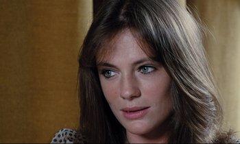 Movie still from “Day for Night” (1973), directed by François Truffaut – A person with long hair; Close Up shot, High angle