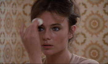 Movie still from “Day for Night” (1973), directed by François Truffaut – A person holding a white object in her hand; Close Up shot, Over the shoulder angle
