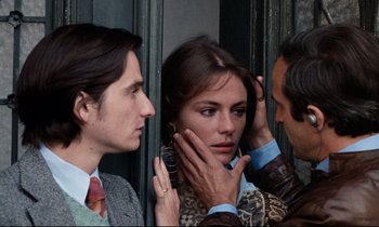 Movie still from “Day for Night” (1973), directed by François Truffaut – A man and a woman looking at each other's face; Close Up shot, Over the shoulder angle