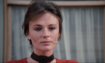Movie still from “Day for Night” (1973), directed by François Truffaut – A person wearing a red shirt; Close Up shot, Low angle