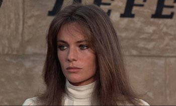 Movie still from “Day for Night” (1973), directed by François Truffaut – A person with long brown hair; Close Up shot, Low angle