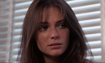 Movie still from “Day for Night” (1973), directed by François Truffaut – A person with long hair; Close Up shot, Low angle