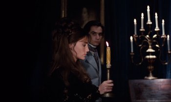 Movie still from “Day for Night” (1973), directed by François Truffaut – A man and a woman are holding a lit candle; Medium shot, Over the shoulder angle