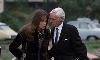 Movie still from “Day for Night” (1973), directed by François Truffaut – An older man and a younger woman standing next to each other; Medium shot, Over the shoulder angle