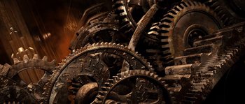 Movie still from “Daybreakers” (2009), directed by Michael Spierig – A bunch of gears that are stacked together; Extreme Close Up shot, Overhead angle