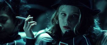 Movie still from “Daybreakers” (2009), directed by Michael Spierig – A young girl smoking a cigarette while wearing a hat; Close Up shot, Over the shoulder angle
