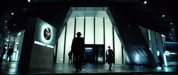 Movie still from “Daybreakers” (2009), directed by Michael Spierig – A group of people walking down a hall way; Wide shot, Low angle