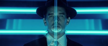 Movie still from “Daybreakers” (2009), directed by Michael Spierig – A man wearing a hat and a suit and tie; Close Up shot, Low angle