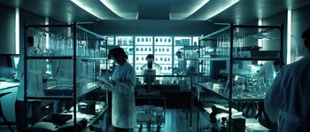 Movie still from “Daybreakers” (2009), directed by Michael Spierig – Two people in lab coats are working in a lab; Wide shot, Low angle