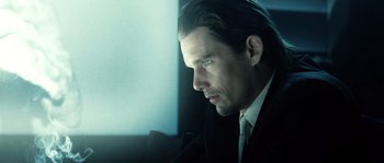 Movie still from “Daybreakers” (2009), directed by Michael Spierig – A person wearing a suit and tie; Close Up shot, Low angle