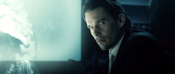 Movie still from “Daybreakers” (2009), directed by Michael Spierig – A person wearing a suit and tie; Close Up shot, Low angle