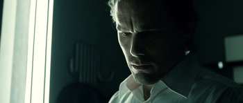 Movie still from “Daybreakers” (2009), directed by Michael Spierig – A person wearing a white shirt; Close Up shot, Low angle