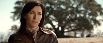 Movie still from “Daybreakers” (2009), directed by Michael Spierig – A person wearing a leather jacket; Close Up shot, Over the shoulder angle