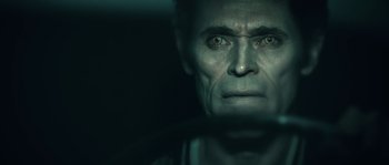 Movie still from “Daybreakers” (2009), directed by Michael Spierig – A person's face in a dark room; Close Up shot, Over the shoulder angle