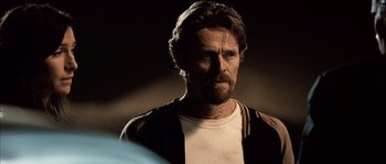 Movie still from “Daybreakers” (2009), directed by Michael Spierig – A person wearing a white shirt; Close Up shot, Over the shoulder angle