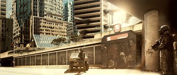 Movie still from “Daybreakers” (2009), directed by Michael Spierig – A man sitting on the back of an all terrain vehicle; Extreme Wide shot, High angle