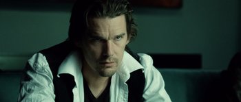 Movie still from “Daybreakers” (2009), directed by Michael Spierig – A person with long hair; Close Up shot, Over the shoulder angle