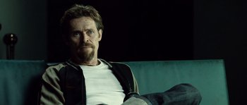 Movie still from “Daybreakers” (2009), directed by Michael Spierig – A person sitting on a couch; Close Up shot, Over the shoulder angle