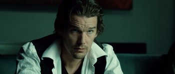 Movie still from “Daybreakers” (2009), directed by Michael Spierig – A person with long hair; Close Up shot, Over the shoulder angle