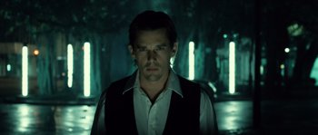 Movie still from “Daybreakers” (2009), directed by Michael Spierig – A man in a white dress shirt and a vest; Close Up shot, Low angle