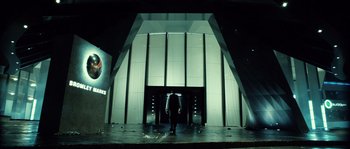 Movie still from “Daybreakers” (2009), directed by Michael Spierig – A man standing in front of a building; Wide shot, Low angle