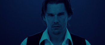 Movie still from “Daybreakers” (2009), directed by Michael Spierig – A person wearing a suit and tie; Close Up shot, Low angle