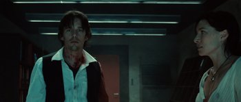 Movie still from “Daybreakers” (2009), directed by Michael Spierig – A man in a white shirt with blood on his face; Close Up shot, Low angle