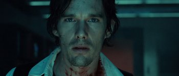 Movie still from “Daybreakers” (2009), directed by Michael Spierig – A person with blood all over his face; Close Up shot, Over the shoulder angle