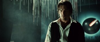 Movie still from “Daybreakers” (2009), directed by Michael Spierig – A man standing in front of icicles in a room; Medium shot, Low angle