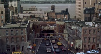 Movie still from “Daylight” (1996), directed by Rob Cohen – An aerial view of a city street with cars driving down it; Extreme Wide shot, High angle