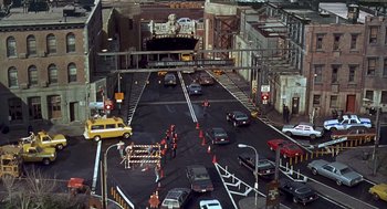 Movie still from “Daylight” (1996), directed by Rob Cohen – Cars are stopped on a busy city street; Extreme Wide shot, High angle