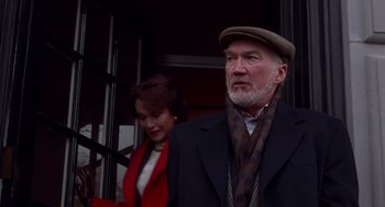 Movie still from “Daylight” (1996), directed by Rob Cohen – An older man and a woman standing next to each other; Close Up shot, Low angle