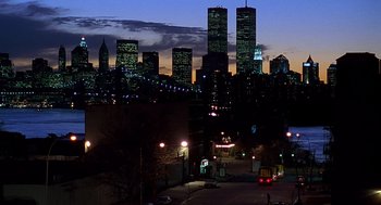 Movie still from “Daylight” (1996), directed by Rob Cohen – A view of a city skyline at night with lights on; Extreme Wide shot, Low angle