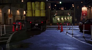 Movie still from “Daylight” (1996), directed by Rob Cohen – A truck is driving down the street at night; Wide shot, Low angle